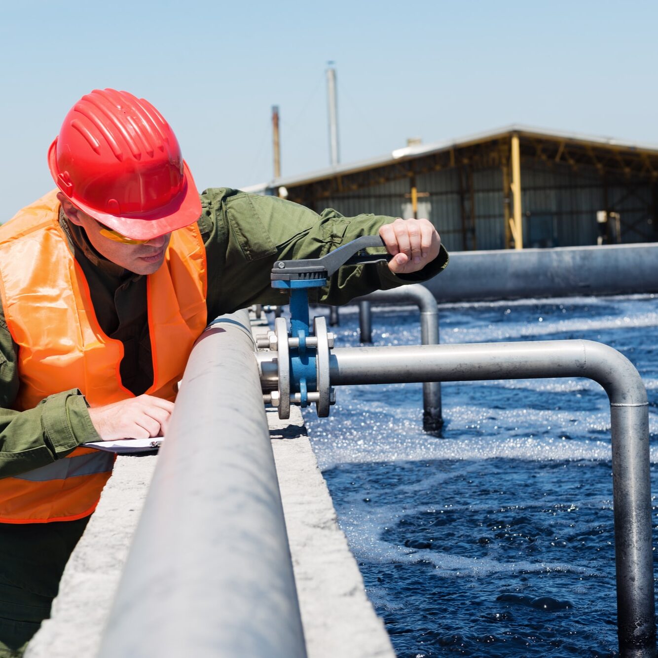 Technician working at wastewater treatment plant